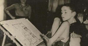 Christy Brown as a young boy, learning to draw with his foot
