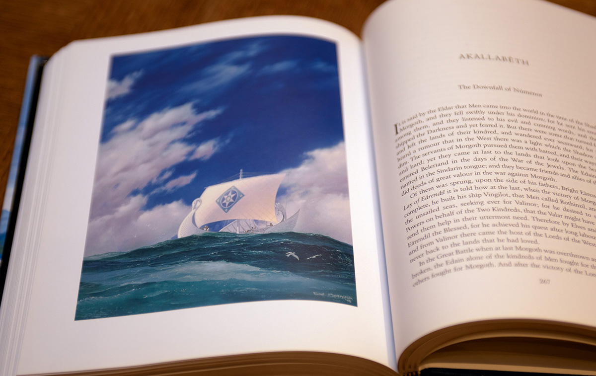 A white ship sailing on a blue ocean from Tolkien The Silmarillion first edition book.