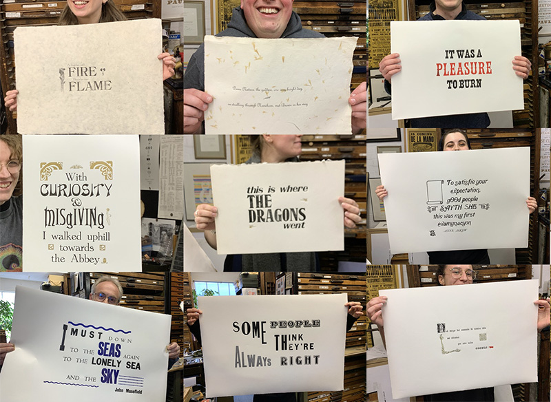 The Peter Harrington booksellers holding up placards with different examples of fonts.